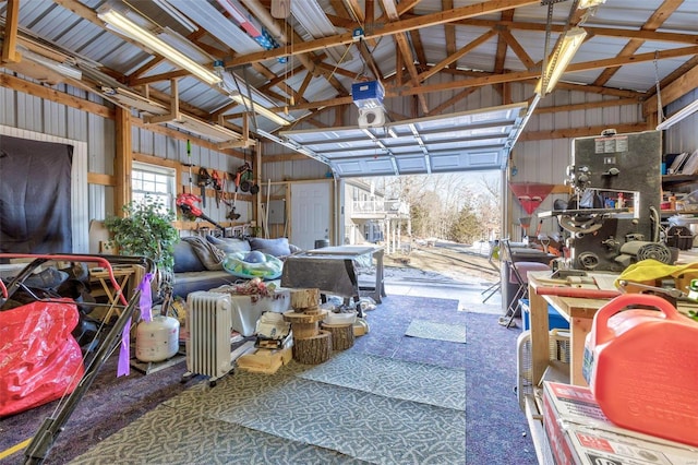 garage featuring wood walls