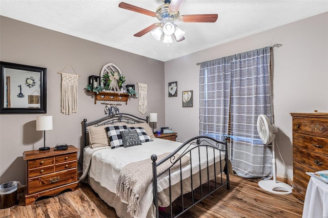 bedroom featuring ceiling fan and hardwood / wood-style flooring