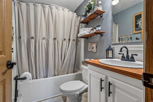 full bathroom with a textured ceiling, toilet, shower / bath combination with curtain, and vanity