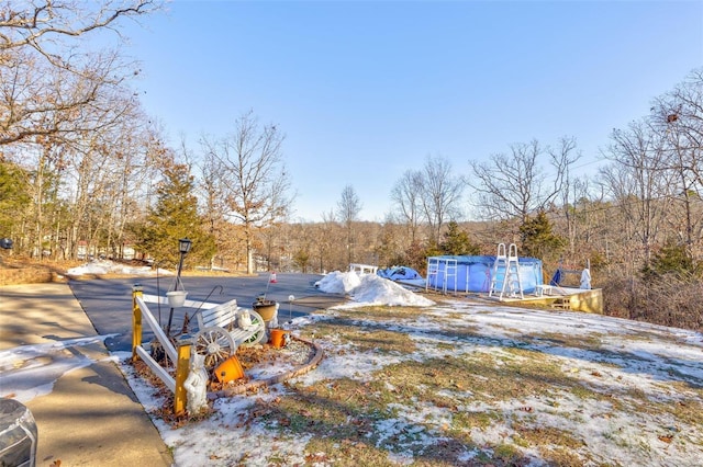 snowy yard with a pool