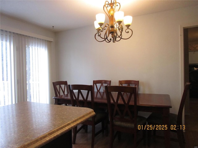 dining space with a chandelier