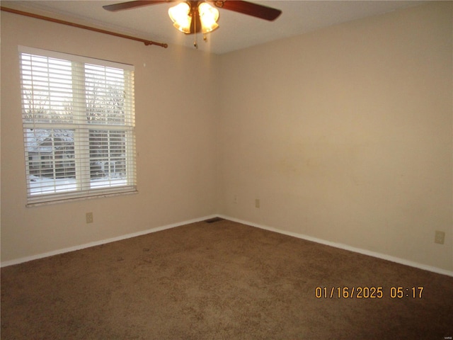 unfurnished room featuring ceiling fan and carpet