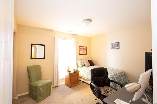 bedroom with light carpet