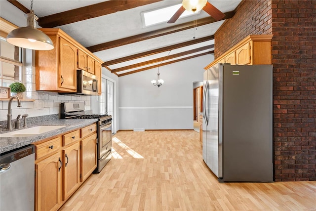 kitchen featuring appliances with stainless steel finishes, lofted ceiling with beams, sink, backsplash, and hanging light fixtures