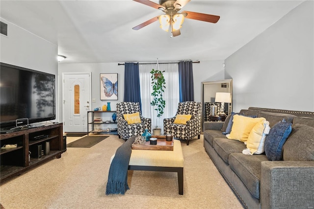 carpeted living room with ceiling fan