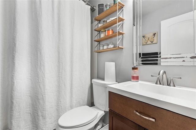 bathroom with toilet and vanity