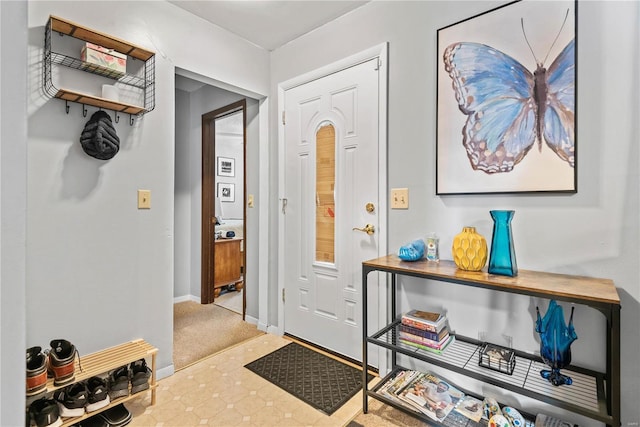 entryway with carpet floors