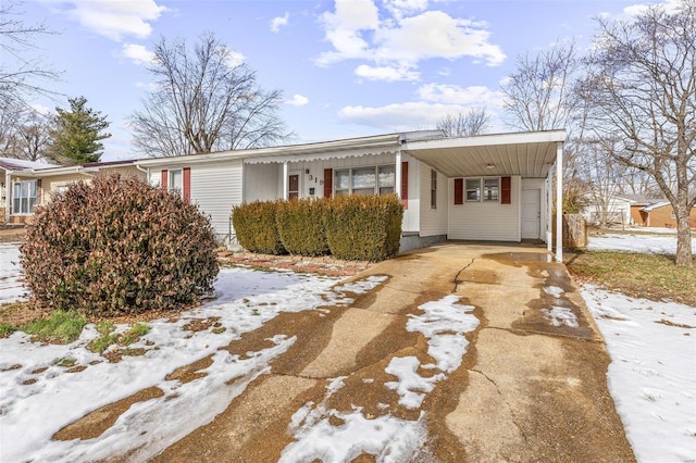 view of front of home with a carport