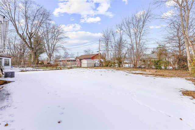 view of yard layered in snow