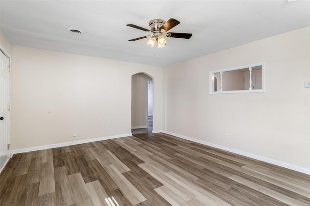 spare room featuring ceiling fan and wood-type flooring