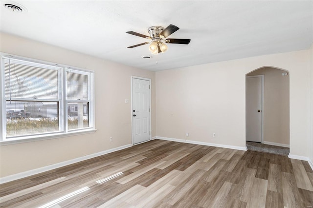 unfurnished room featuring ceiling fan and light hardwood / wood-style flooring