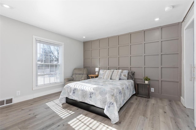 bedroom featuring light hardwood / wood-style floors