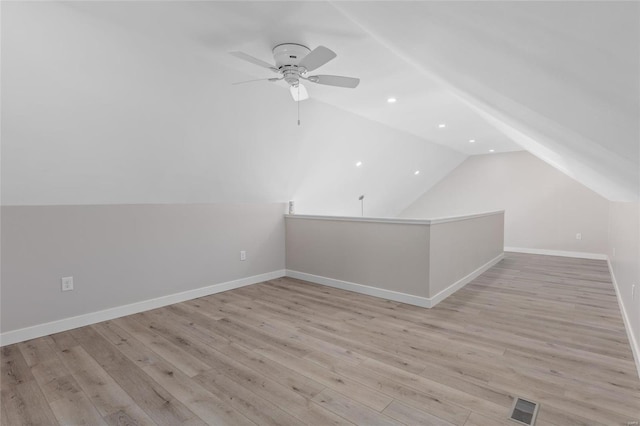 bonus room featuring ceiling fan, vaulted ceiling, and light hardwood / wood-style floors