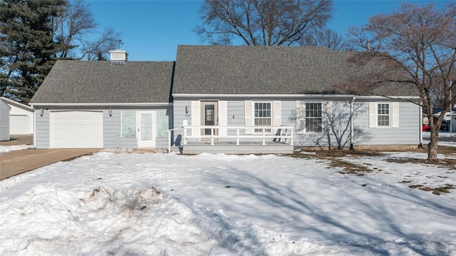 view of front of property with a garage and covered porch