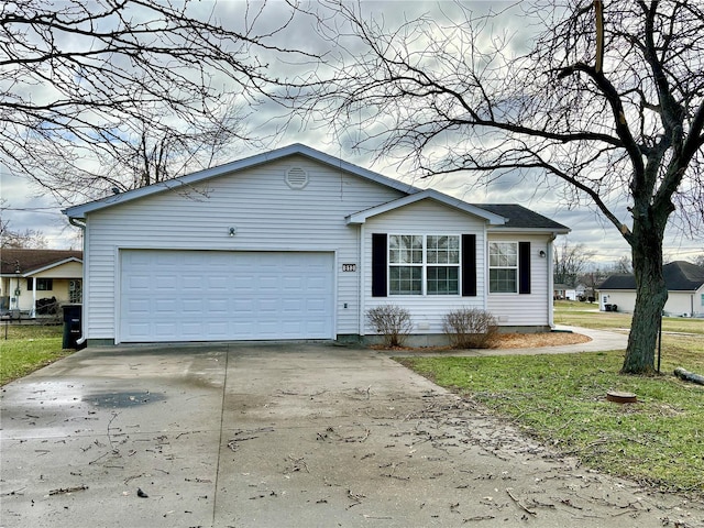 view of front of property with a front lawn and a garage