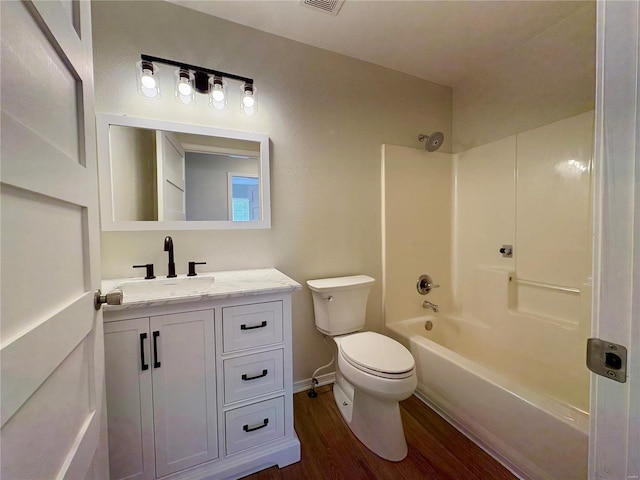 full bathroom featuring toilet, vanity, shower / bathtub combination, and hardwood / wood-style flooring