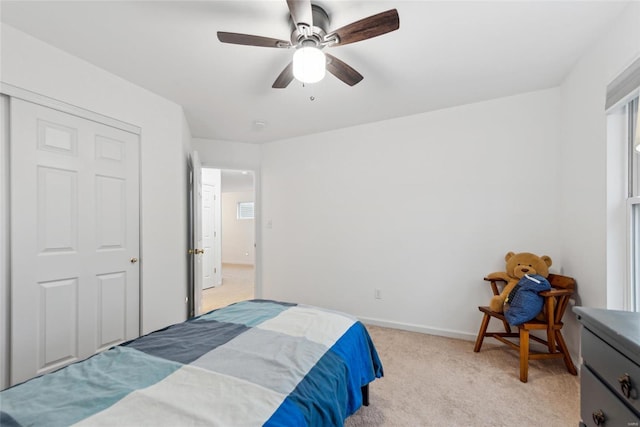 bedroom featuring ceiling fan and light colored carpet