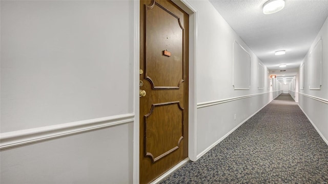 corridor with a textured ceiling