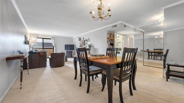 carpeted dining space featuring a notable chandelier, ornamental molding, and a textured ceiling