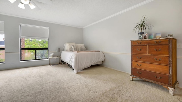 bedroom featuring ceiling fan, ornamental molding, light carpet, and a textured ceiling