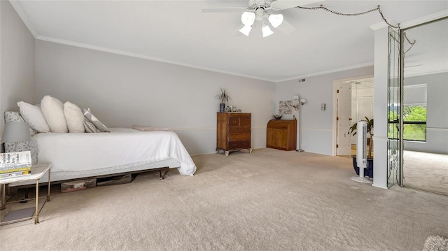 carpeted bedroom with ceiling fan and ornamental molding