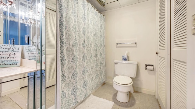 bathroom featuring tile patterned floors and toilet