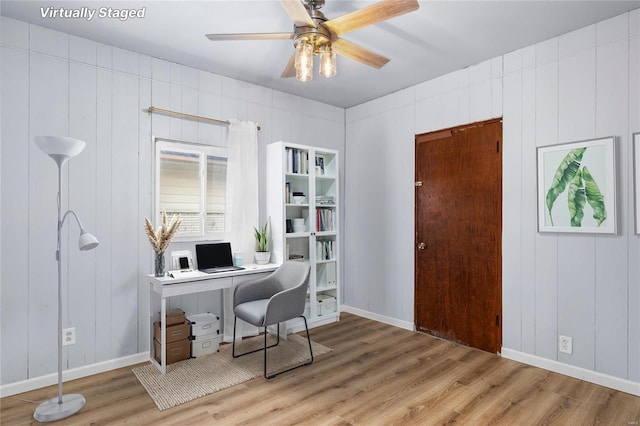 office with hardwood / wood-style flooring and ceiling fan