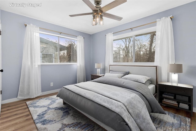 bedroom featuring ceiling fan and hardwood / wood-style floors