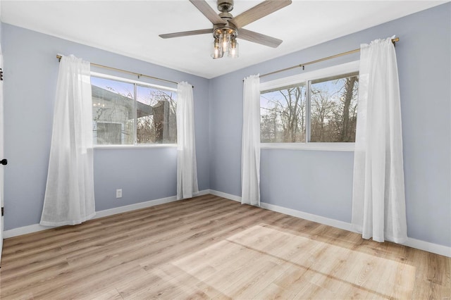 spare room with ceiling fan and light hardwood / wood-style flooring