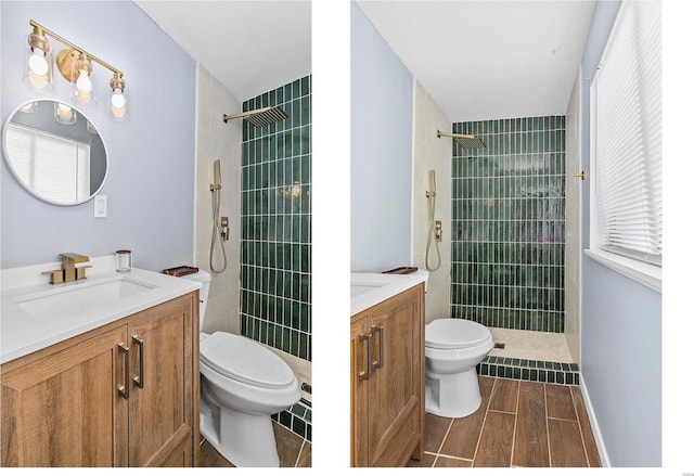 bathroom featuring vanity, toilet, and a tile shower