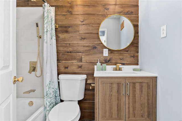 full bathroom with toilet, vanity, wood walls, and shower / bathtub combination with curtain