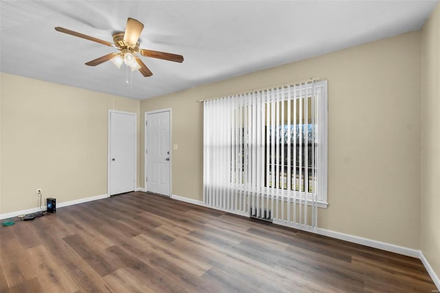 unfurnished room featuring ceiling fan and dark hardwood / wood-style flooring