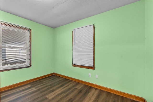 empty room featuring dark hardwood / wood-style floors