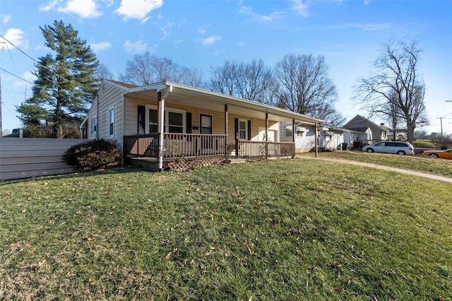 view of front of property featuring a front yard and covered porch