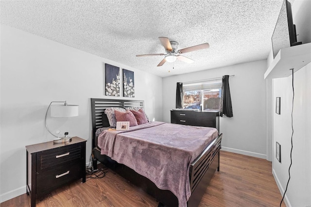 bedroom with hardwood / wood-style floors, a textured ceiling, and ceiling fan