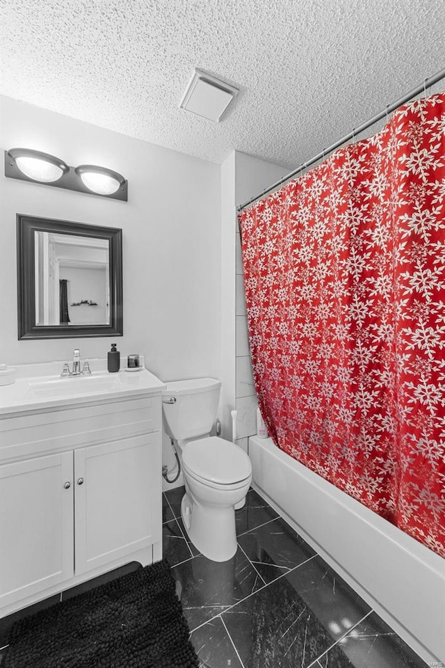 full bathroom featuring vanity, toilet, shower / tub combo, and a textured ceiling