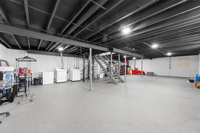 basement featuring independent washer and dryer and refrigerator