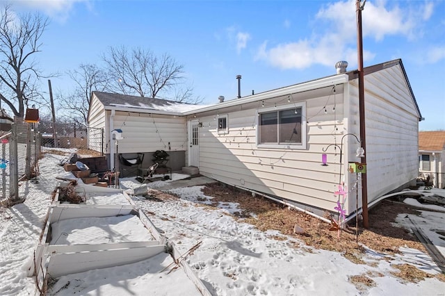 view of snow covered house