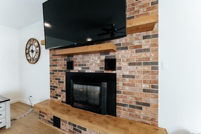 details with a fireplace and baseboards