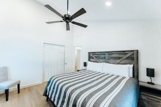 bedroom featuring recessed lighting, a closet, a ceiling fan, wood finished floors, and baseboards