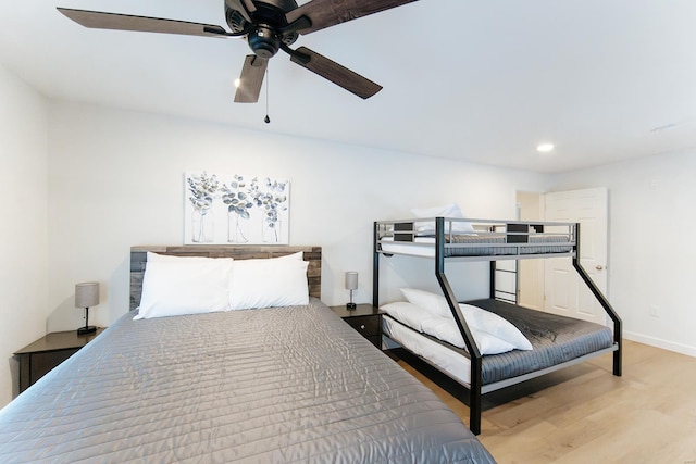 bedroom featuring ceiling fan, recessed lighting, light wood-style flooring, and baseboards