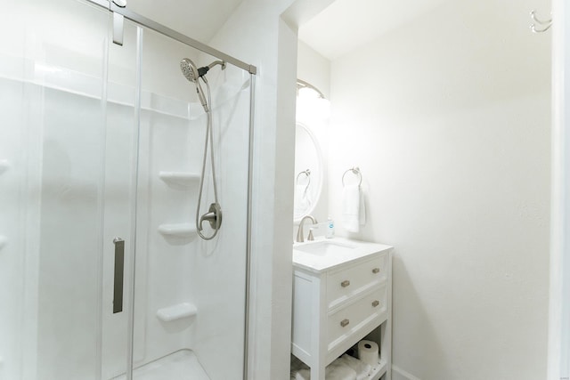 bathroom featuring a stall shower and vanity