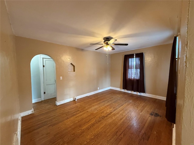 spare room with ceiling fan and hardwood / wood-style flooring