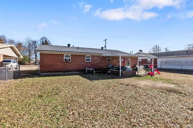 rear view of property with central AC, a patio area, and a yard