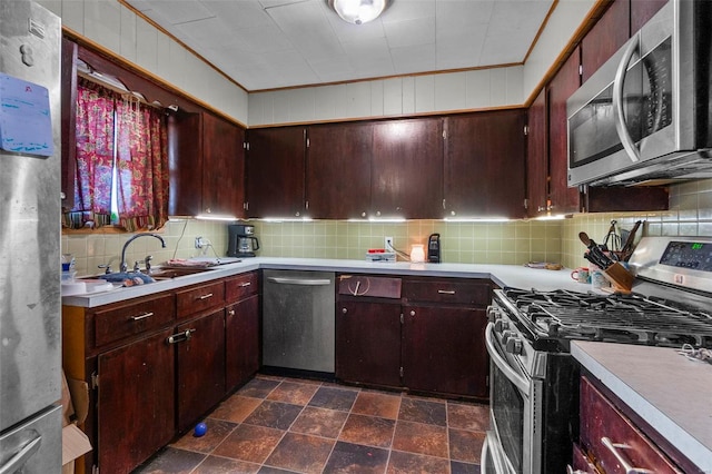 kitchen with sink, backsplash, and stainless steel appliances