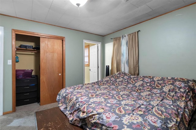 carpeted bedroom with a closet