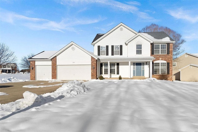 view of front of property with a garage and covered porch