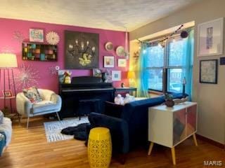 living area with wood-type flooring