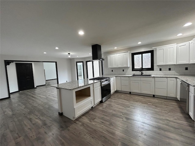 kitchen featuring island range hood, stainless steel range with gas stovetop, dark wood-style flooring, open shelves, and a sink