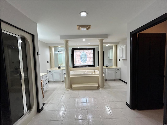 full bathroom featuring a stall shower, decorative columns, a sink, and a bath